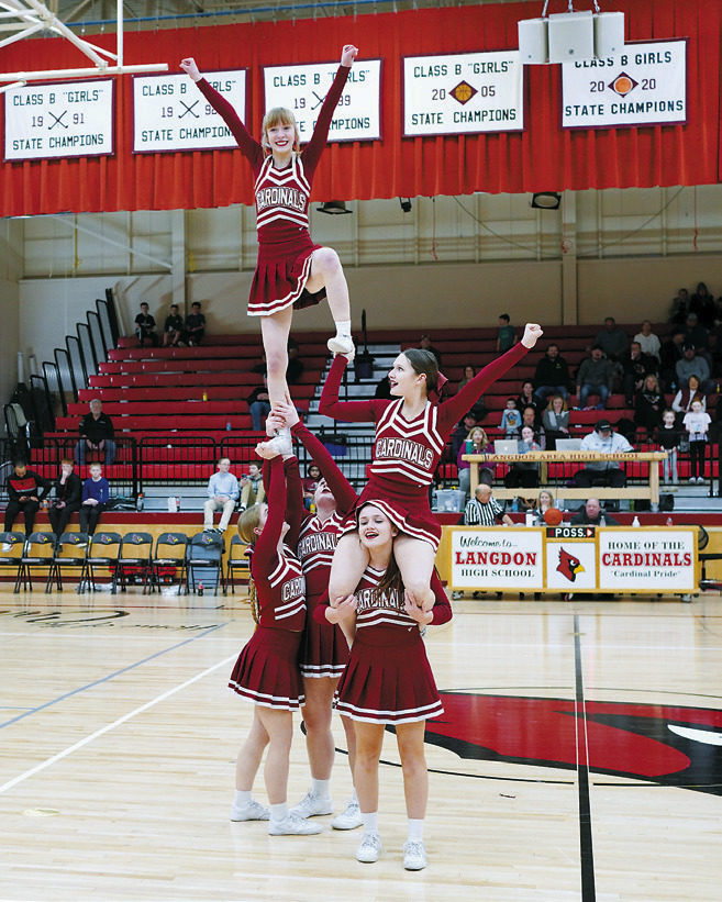 The Cardinals Cheer Team was busy keeping the crowd fired up. Photo by Larry Stokke.