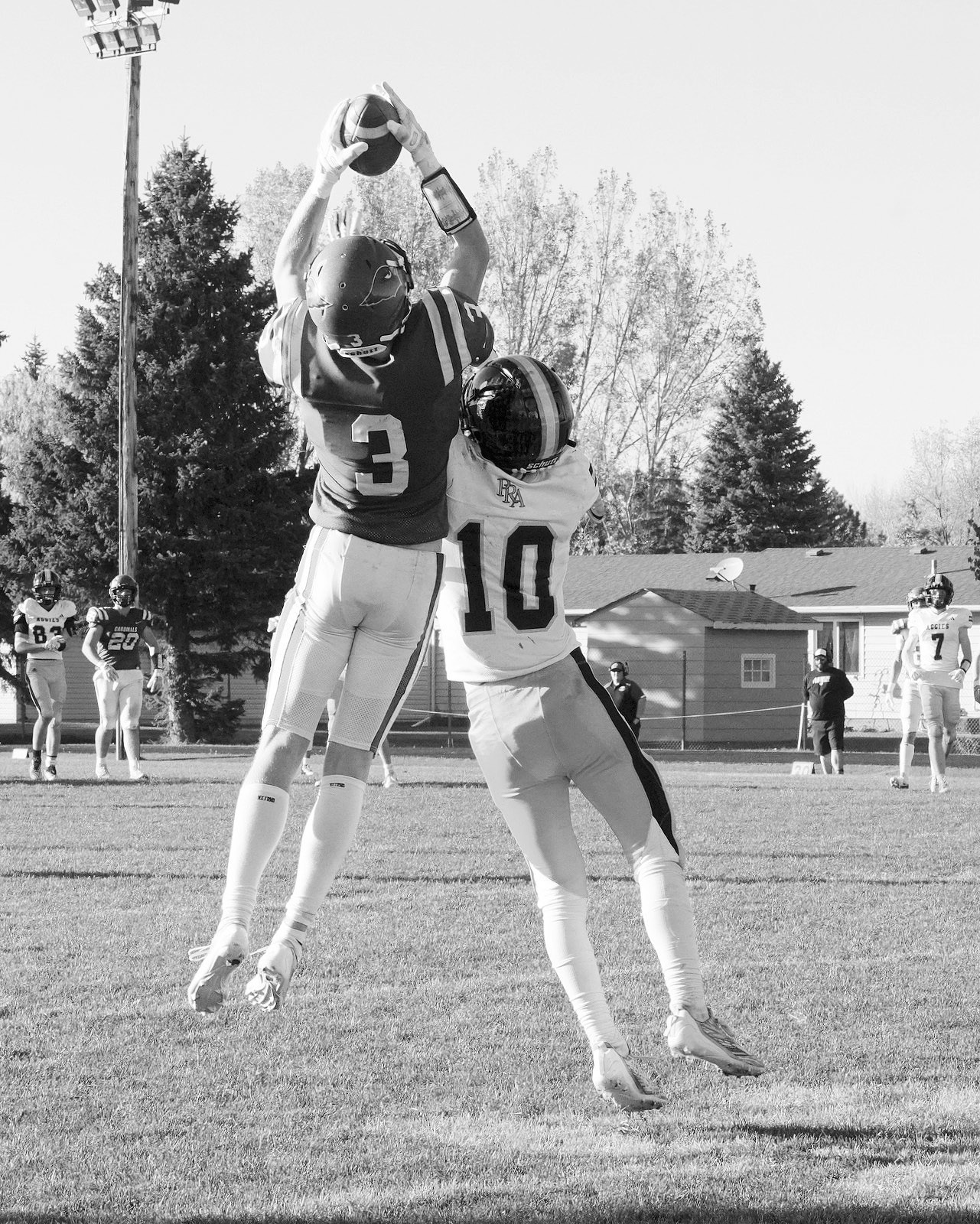 Cody Amble intercepts the ball on a pass to the Aggies Aiden Rost. Photo by Larry Stokke.