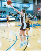Ary Schaefer drains a 3-point basket in Mayville in the state qualifier game. Photo by Larry Stokke