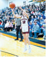 Kemi Morstad drops in a 3-point basket at regionals in Larimore. Photo by Larry Stokke