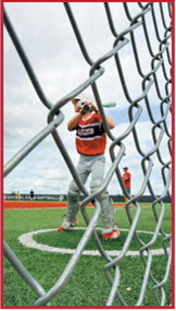 Langdon 10U player Aksel Bredeson prepares to swing while viewed through the backstop during youth baseball action this season. Submitted photo