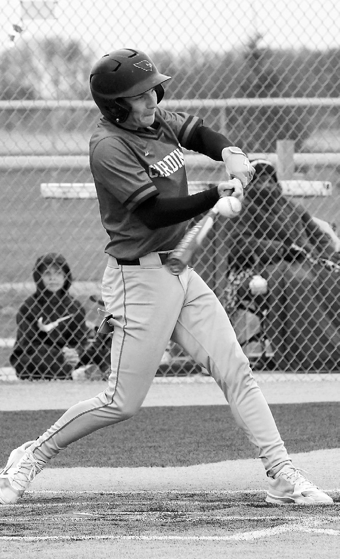 Sam Davis drives one into the outfield for a base hit against Grafton in Park River May 19. Photo by Larry Stoke.