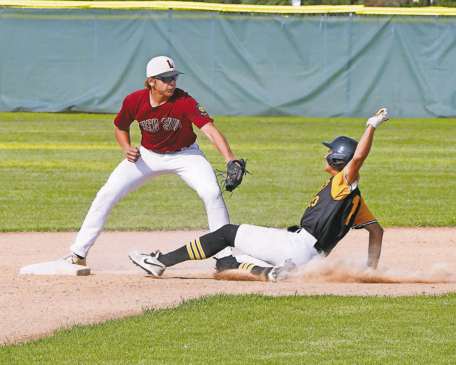 Jax Johnson tags out a Park River player at 2nd base Photo by Larry Stokke..
