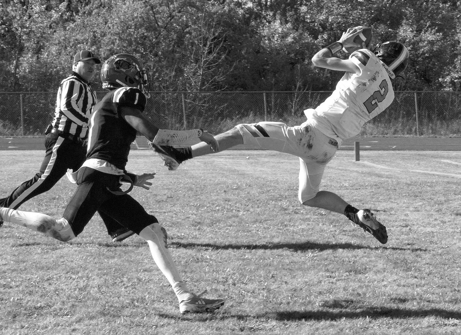 Ryan Pettetier leaps to make a great catch, tacking on 6 points for the Tornadoes in their win over Four Winds on Oct 19. Photo by Larry Stokke.