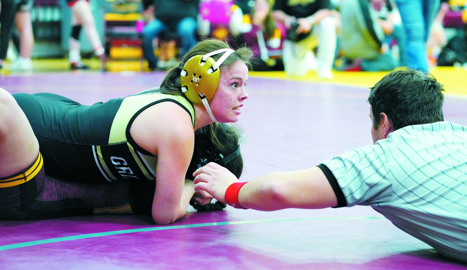 Ava Kemnitz stares ahead with great concentration as she gets the win in Belcourt on Dec. 7. Photo by Larry Stokke.