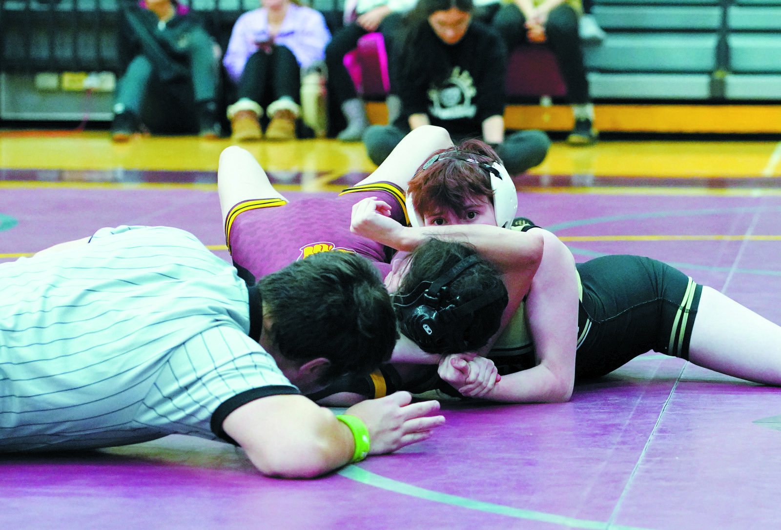 Cheyenne Moore stares ahead waiting for the referee to signal her win by pinfall. Photo by Larry Stokke.