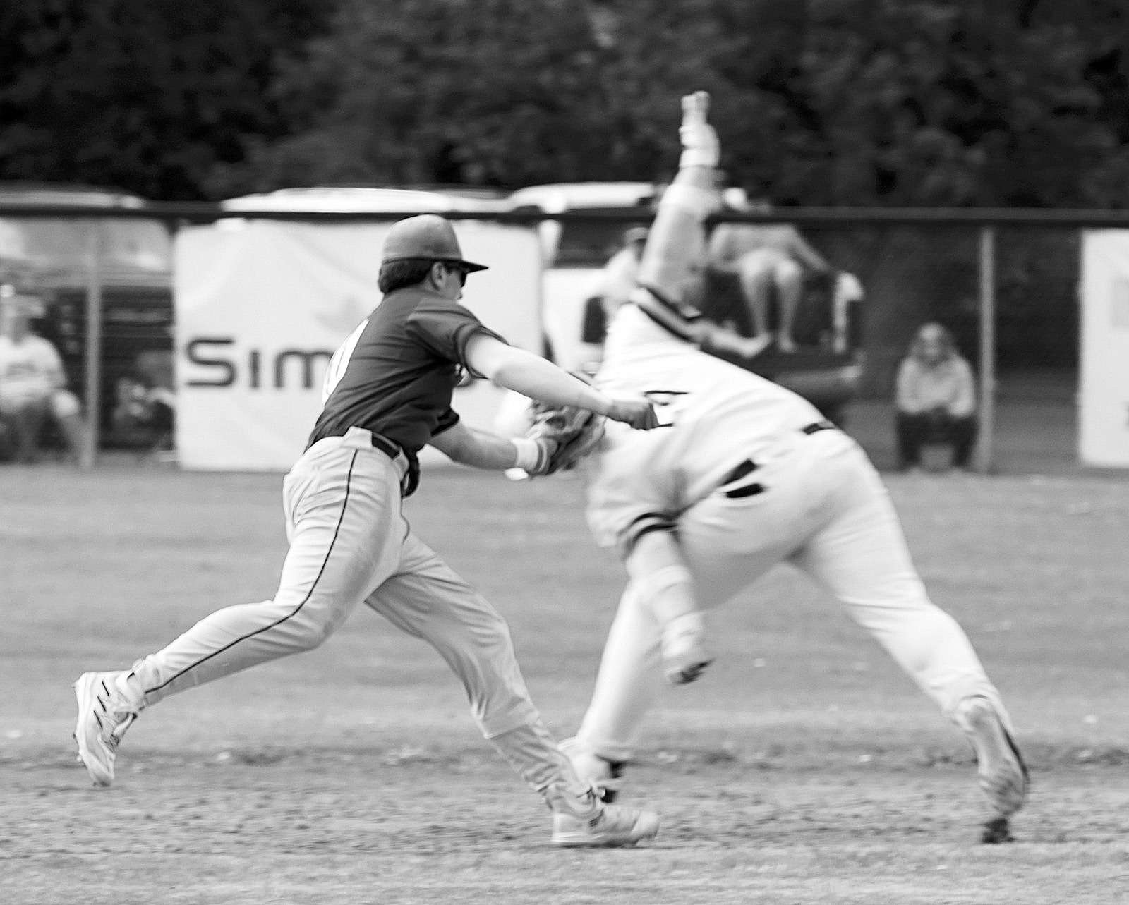 Mason Romfo runs down a Grafton Spoiler between 1st and 2nd base for an out. Photo by Larry Stokke.