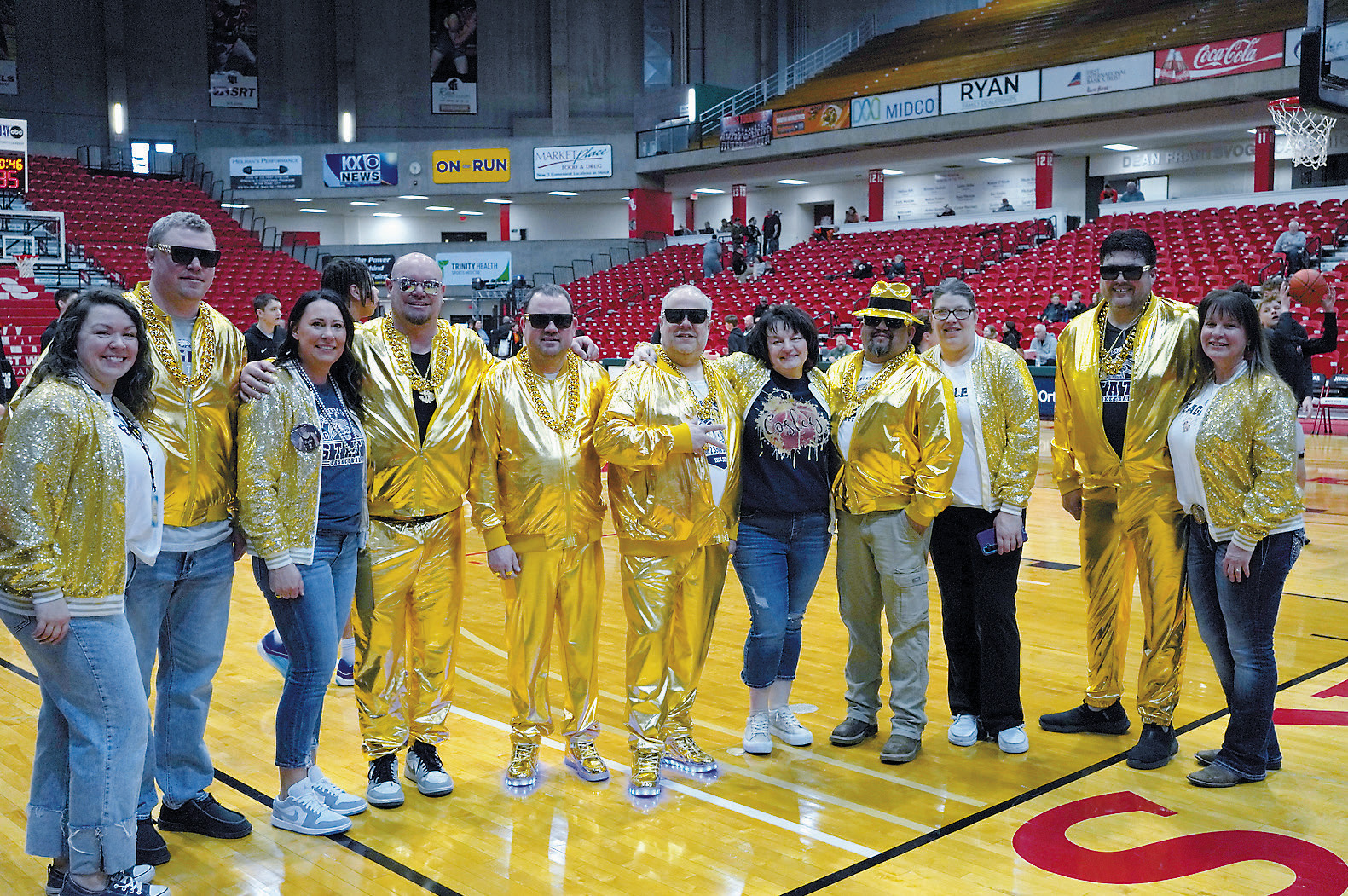 Some of the parents came decked out in gold to show their support for the Eagles at the state tournament. Photo by Larry Stokke.