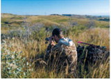 Bowhunter glassing in western North Dakota. Photo courtesy of ND Game and Fish