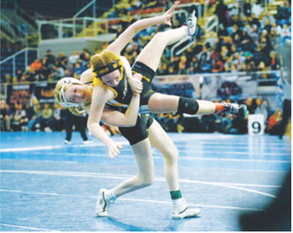 Charlotte Crowston takes her girl off her feet and pinned her in 1 minute 56 seconds, giving her a second place finish at State. Photo by Larry Stokke
