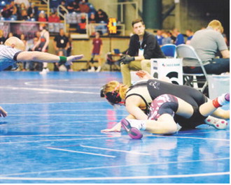 Dannika Bennett pinned her girl in 58 seconds and placed fourth at the State Tournament. Photo by Larry Stokke