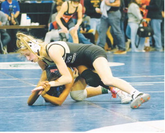 Maci Puppe won her match by decision and finished with an eighth-place finish at State. Photo by Larry Stokke