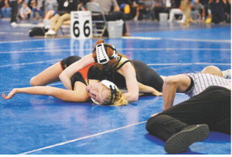 Marlie Stremick pinned her opponent on her way to a third-place finish at State. Photo by Larry Stokke