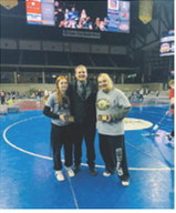 2026 ND Girls Coach of the Year, Crag Brodeur, with Pembina County seniors Marlie Stremick and Jaelyn Forrey. Submitted photo