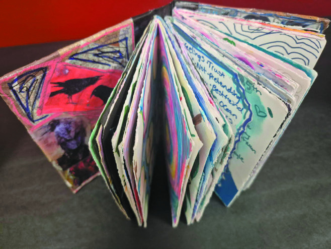 An art journal on display at the student Art Show.