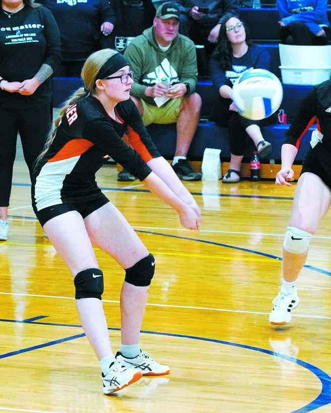 Maelle Robinson digs the ball in the Tornadoes game against the Eagles. Photo by Larry Stokke.