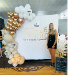 Boutique owner Jennifer Hendrickson poses during the grand opening of The Style Studio in Langdon. Hendrickson recently launched the clothing and accessories boutique inside Glitz &amp; Glam Beauty Bar, combining her passions for hairstyling and fashion. Submitted photo