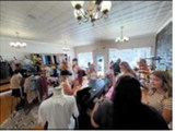 Customers browse clothing, accessories and gifts during the grand opening celebration of The Style Studio inside Glitz &amp; Glam Beauty Bar in downtown Langdon. The event featured shopping, refreshments and several specialty vendors as residents welcomed the new boutique to Main Street. Submitted photo