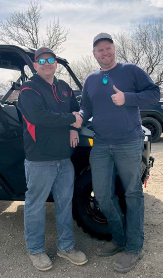 The grand prize winner was Hayes Haslekaas being congratulated here by Wales Fire Department member Brandon Domres. Submitted Photo.