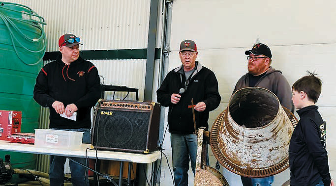 Event organizers pull names for prize winners. Photo by Larry Stokke.