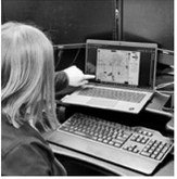 Kristen Knudtson of the North Dakota state office of the Farm Service Agency, looks at a farm acreage report that was scanned after being filled out by hand by a farmer. The agency is using a new system to speed up processing of acreage reporting maps. (Photo by Jeff Beach/North Dakota Monitor)