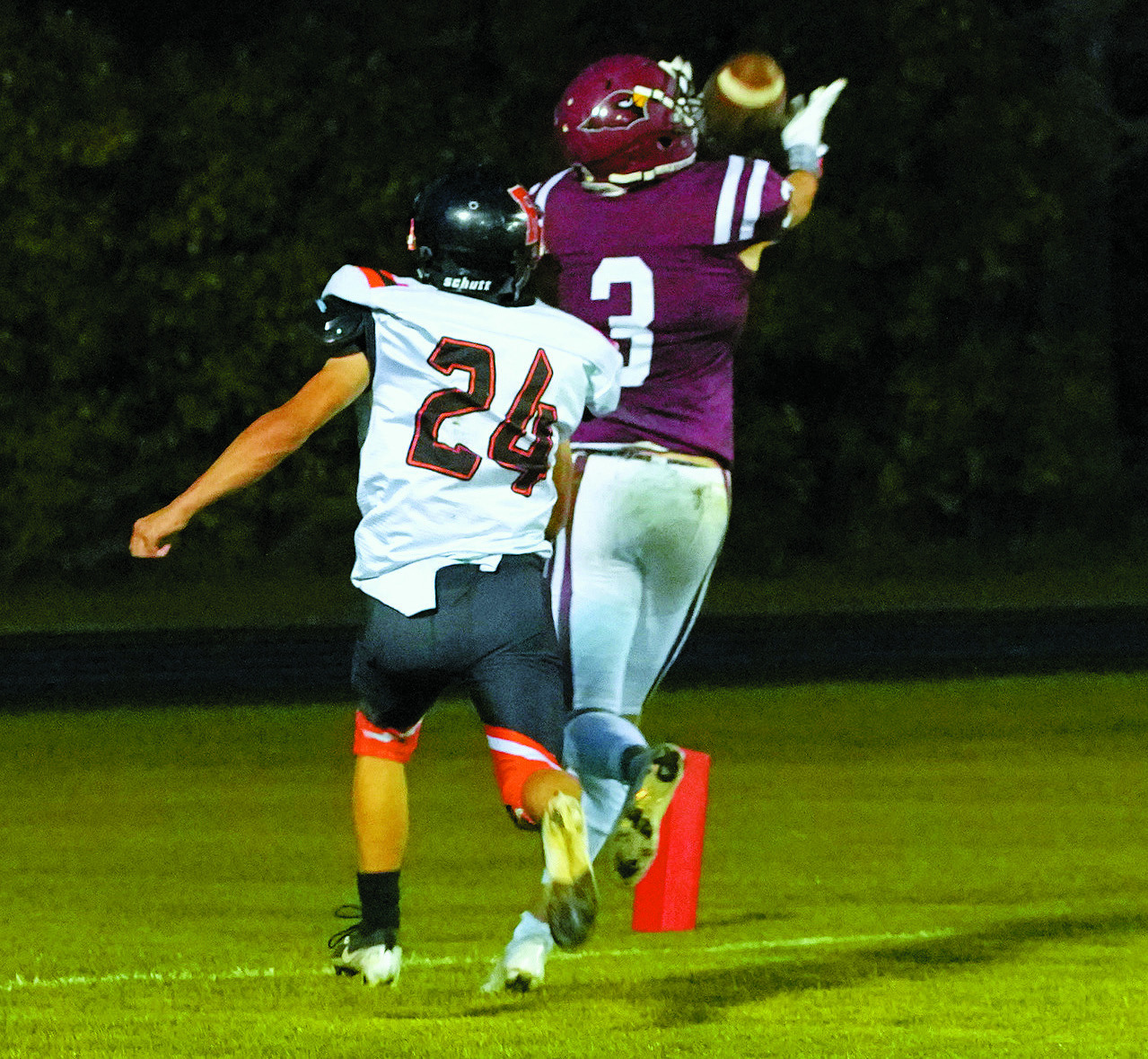 Cody Amble makes a great over the shoulder catch for one of his three touchdowns. Photo by Larry Stokke.