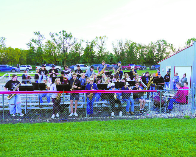 The Cardinal Pep Band playing the National Anthem at the Homecoming Game on Sept. 20. Photo by Larry Stokke.