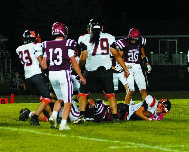 Connor Mitchell with a great tackle stopping a Panther player from scoring. Photo by Larry Stokke.