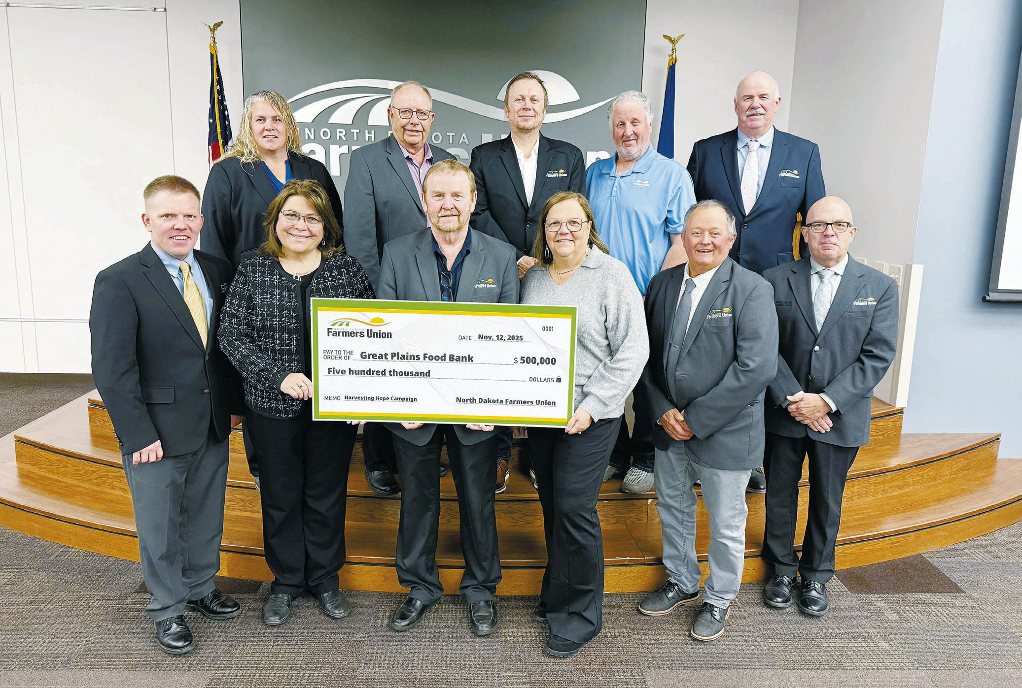 Pictured with NDFU President Mark Watne and the NDFU State Board of Directors are Marcia Paulson (at left), GPFB philanthropy officer, and Michelle Watne, Harvesting Hope Campaign honorary co-chair.