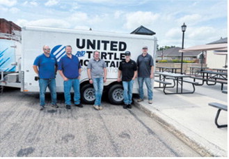 United Telephone employees helped set up tables on Boyd Block for the day's events. Borderland Press photo