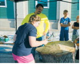 Participants test their aim during the popular hammerschlagen competition at the Pre-Blast Bash. Photo by Larry Stokke