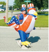 Patriotic spirit was on full display during the Pre-Blast Bash parade as a participant sported a red, white and blue inflatable costume. Photo by Larry Stokke