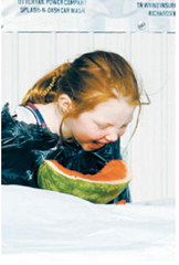 A young contestant digs into a watermelon during the Pre-Blast Bash watermelon-eating contest, one of several family-friendly activities held throughout the day. Photo by Larry Stokke