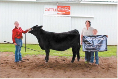 Bailey Samuelson earned Grand Champion Purebred Simmental Heifer honors at the North Dakota Junior Simmental Field Day in Carrington. Submitted photo