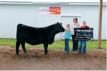 Peyton Samuelson captured Reserve Champion Purebred Simmental Heifer honors at the North Dakota Junior Simmental Field Day in Carrington. Along with exhibiting cattle, participants competed in a variety of educational contests designed to develop industry knowledge and leadership skills. Submitted photo