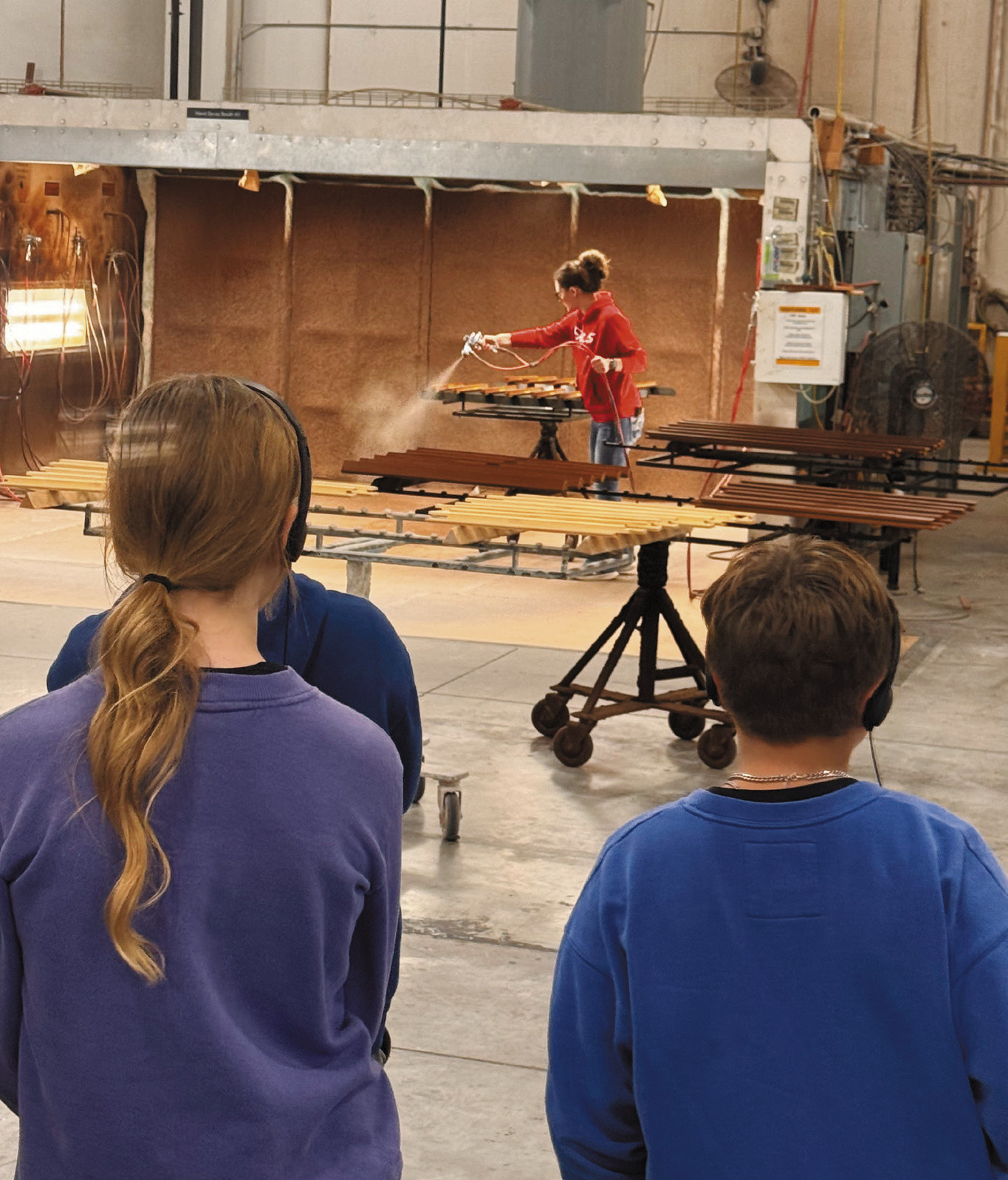Employees show local students the process of building, priming, and painting windows during a tour of the Marvin plant in Grafton as part of the Pembina-Walsh MFG Day event.