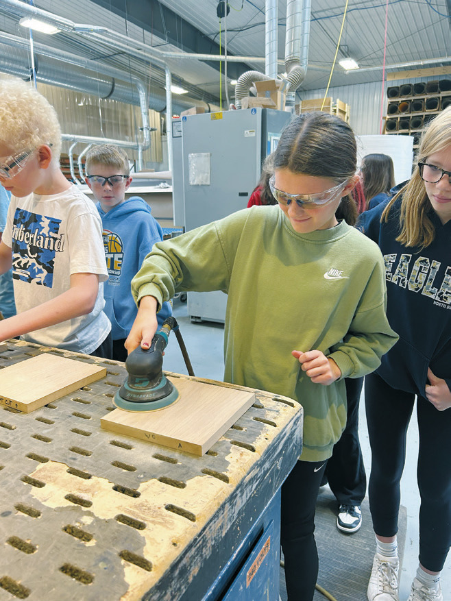 Giving students a hands-on experience at Woodside Industries.