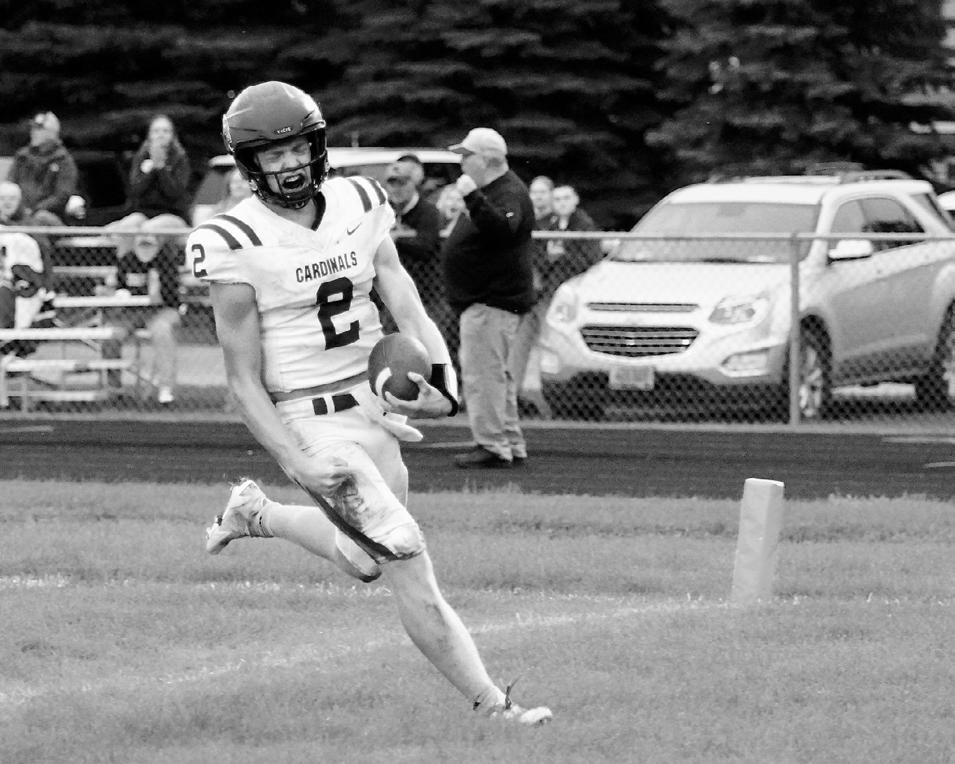Jax Johnson crosses the goal line for a touchdown, finishing the game with 111 yards rushing and two touchdowns. Photo by Larry Stokke.