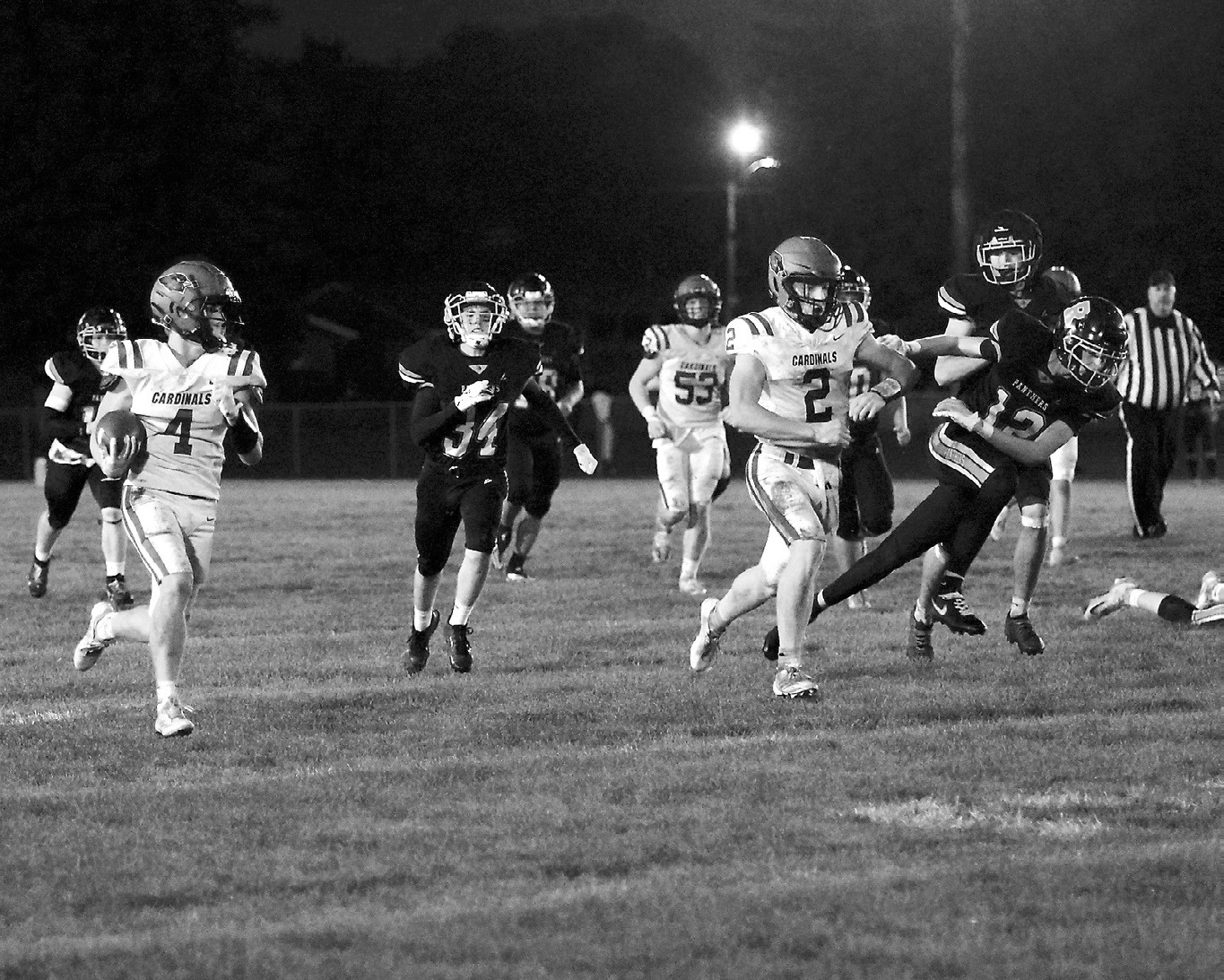 Sam Davis runs in a touchdown with help from Jax Johnson who blocked a Panther from getting any closer to Davis. Photo by Larry Stokke.