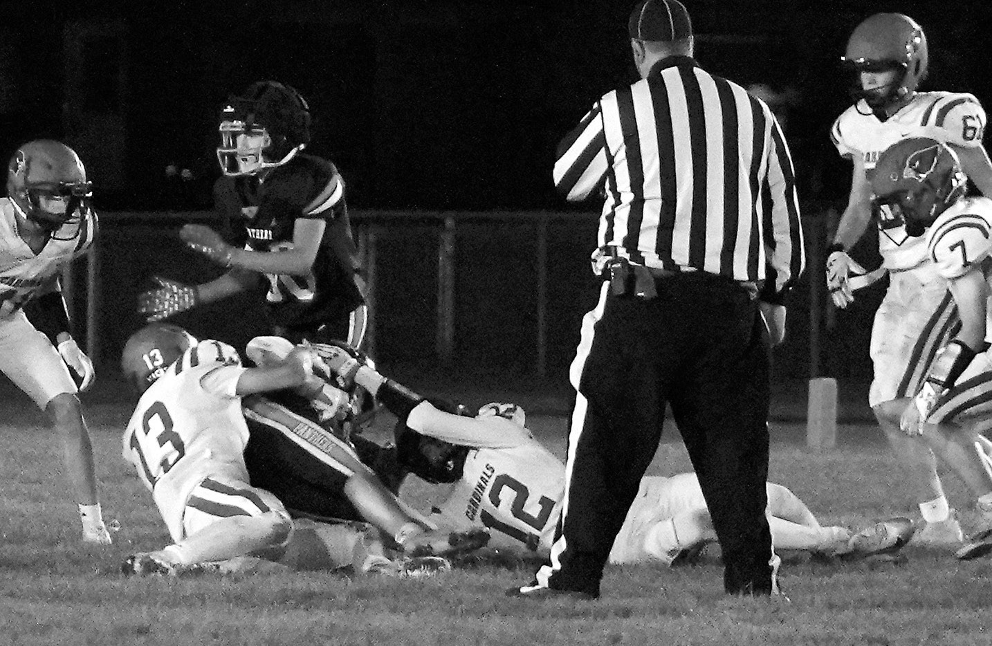 Gavin Trottier and Shaun Kelso team-up to take down a Rugby Panther ball carrier. Photo by Larry Stokke.