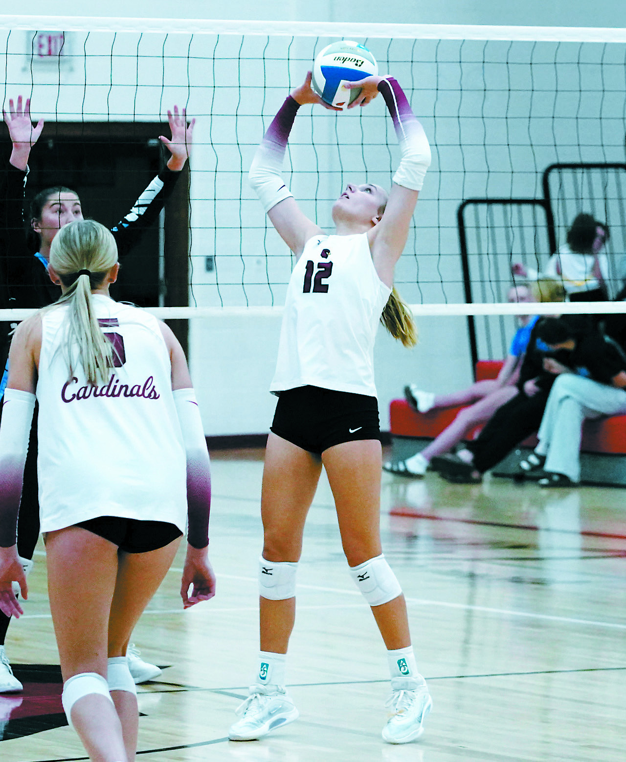 Co-Player of the Game Kemi Morstad had 20 assists, seven kills and eight digs in the Cardinals' win over NRS. Photo by Larry Stokke.