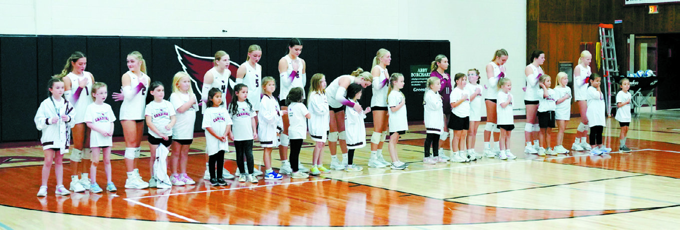 Sept. 25 was 'Buddy Night' for the Cardinals and their young buddies. Photo by Larry Stokke.