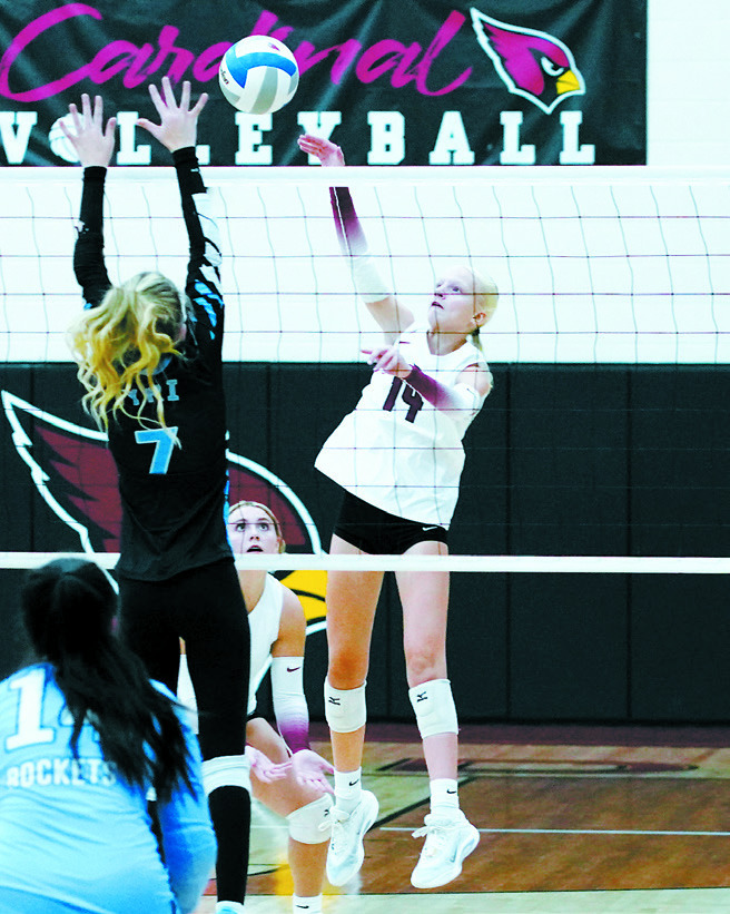 Mya Swanson sends the ball over the net for a kill against the Rockets. Photo by Larry Stokke.