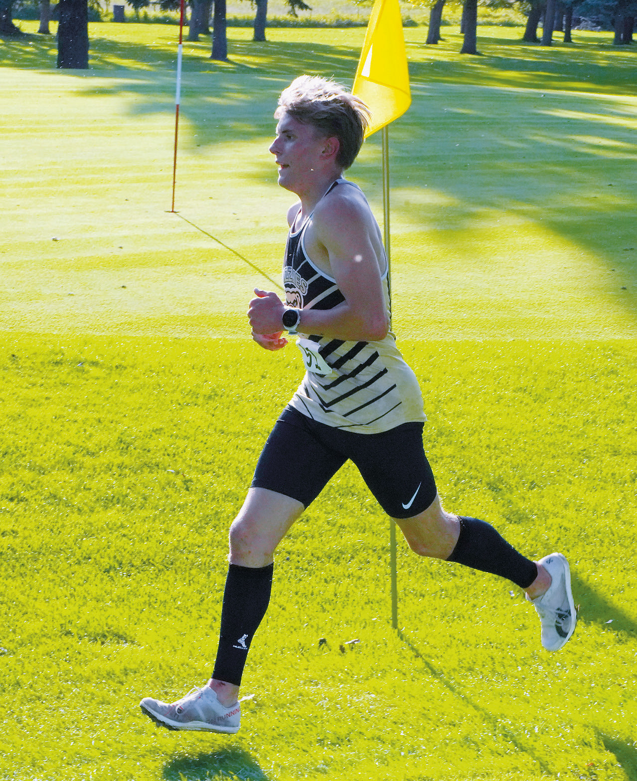 Nash Fitzsimonds set a fast place early and finished first in the meet with a time of 18:16.69. Photo by Larry Stokke.