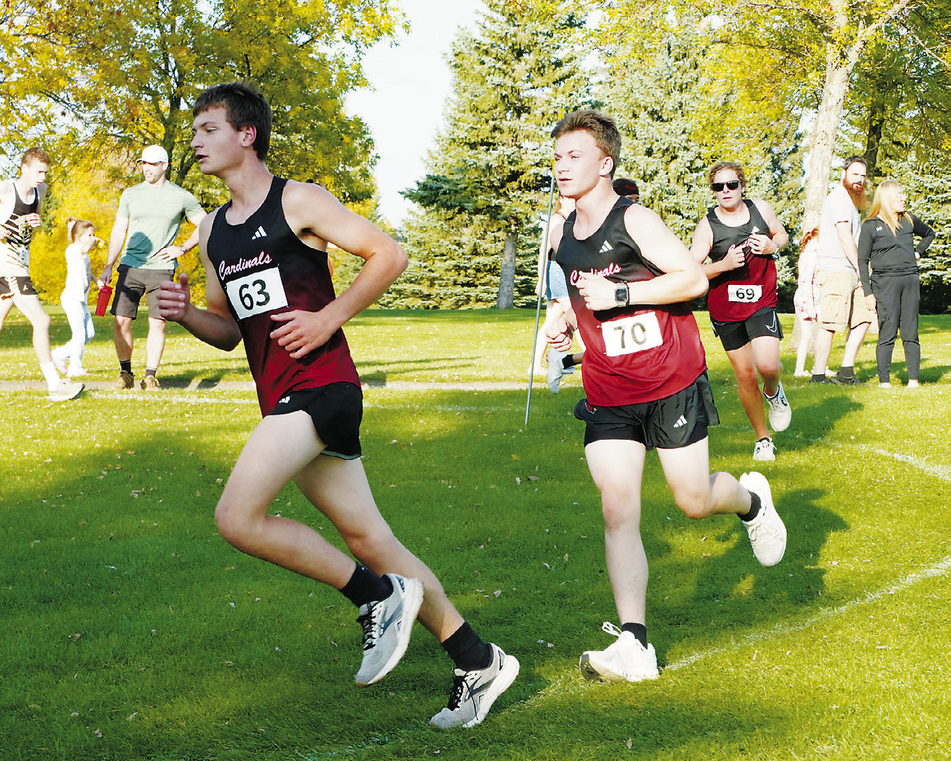 Tyler Borgen followed by Carter Mosher and Ryder Moser round a corner at the meet in Langdon. Photo by Larry Stokke.