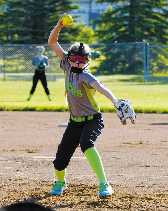 Sadie Pankratz winds up and send a strike across the plate against Grand Forks on June 8. Photo by Larry Stokke.