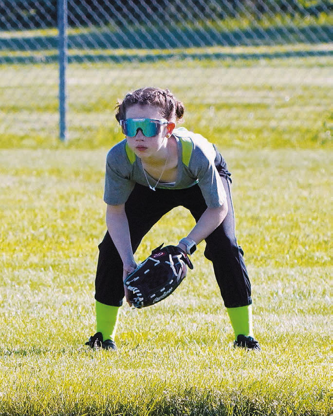 Aria Olson shows great concentration while waiting for the batter. Photo by Larry Stokke.