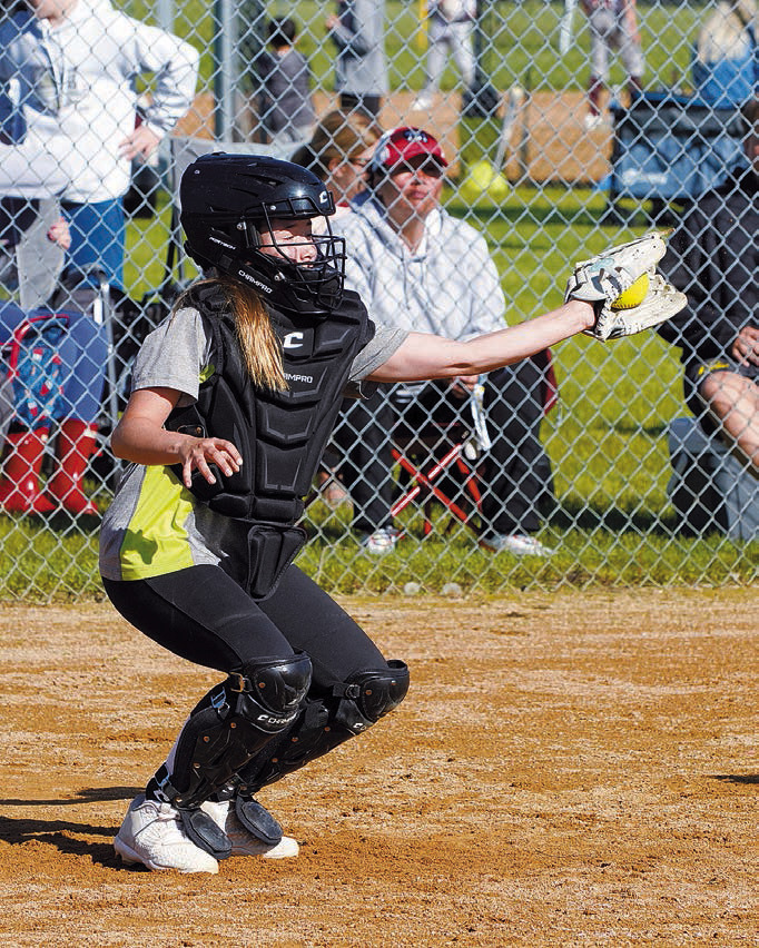 Marah Romfo with a catch behind the plate. Photo by Larry Stokke.