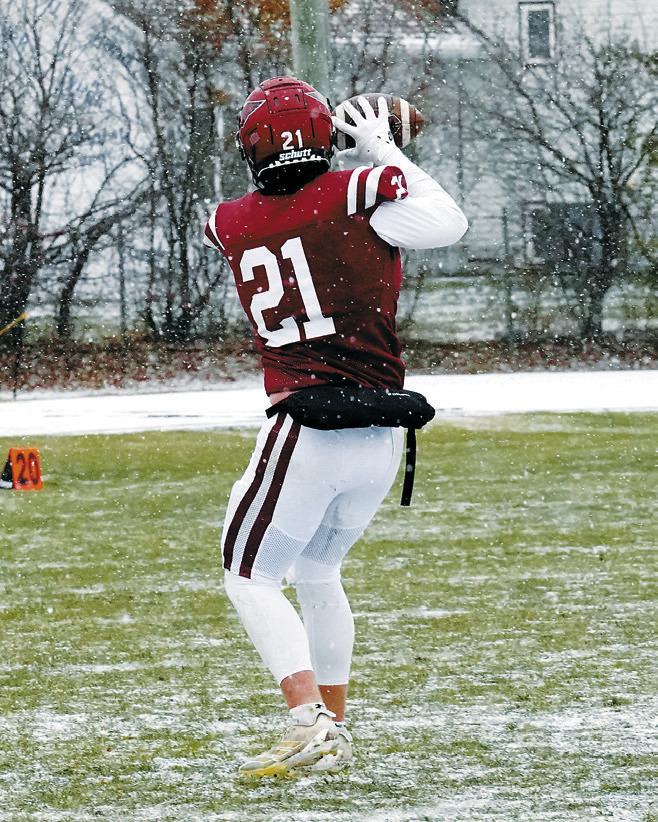 Theo Romfo with a reception for a first down in the Cards' win over Velva. Photo by Larry Stokke.