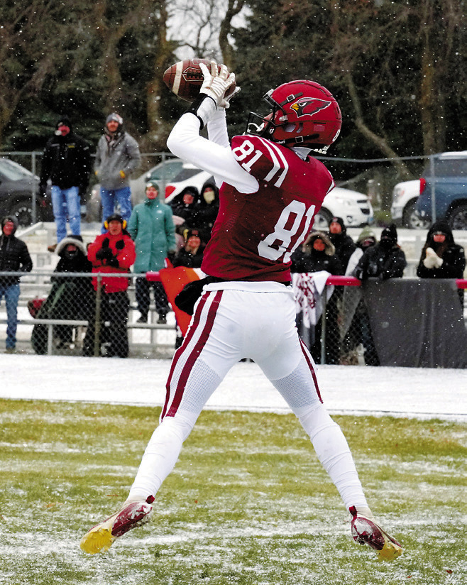 Tanner McDonald makes a crucial two-point conversion catch against Velva-G-D-A. Photo by Larry Stokke